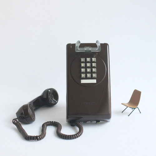 vintage brown button wall phone 